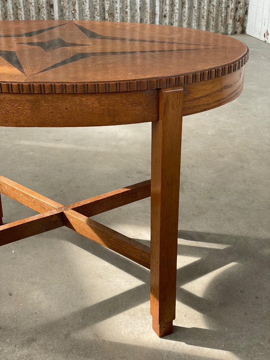 Oval shape ‘Amsterdamse school’ side table in oak and ebony 1930s