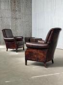 Pair vintage sheep leather armchairs with ottomans