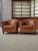 Vintage pair leather clubchairs in brown 