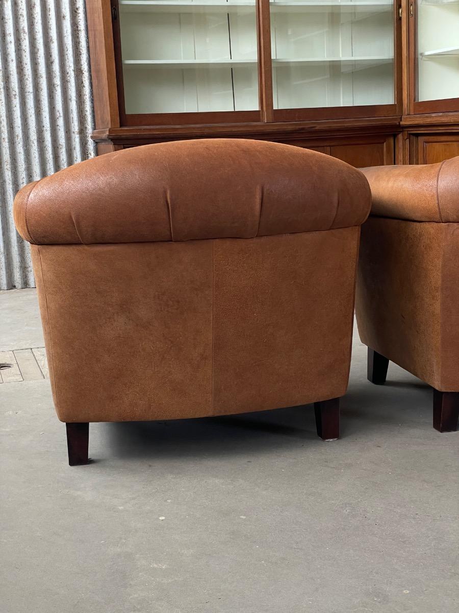 Vintage pair leather clubchairs in brown 