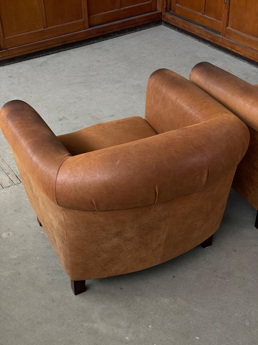 Vintage pair leather clubchairs in brown 