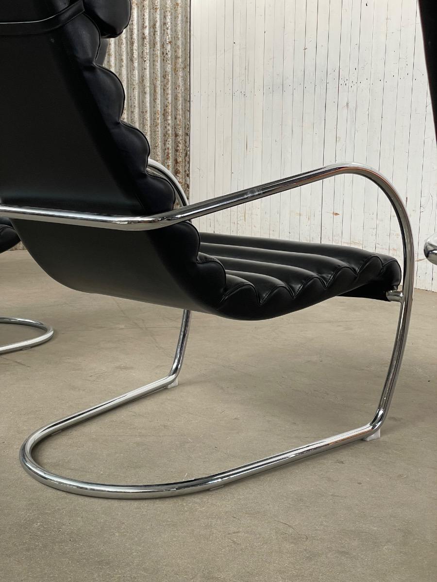 Vintage rare design lounge chairs 1970s tubular frame and black leather 