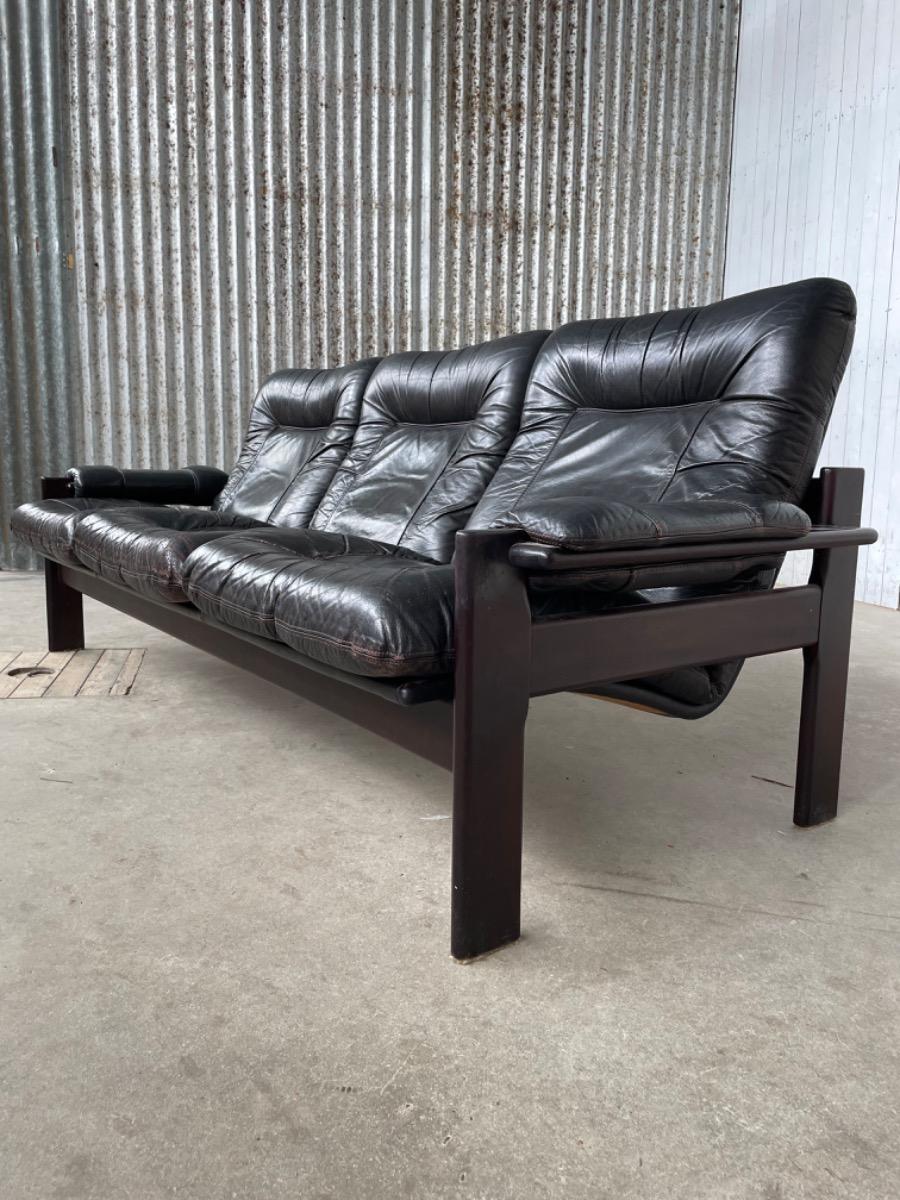 Vintage sofa black thick leather, design 1960s