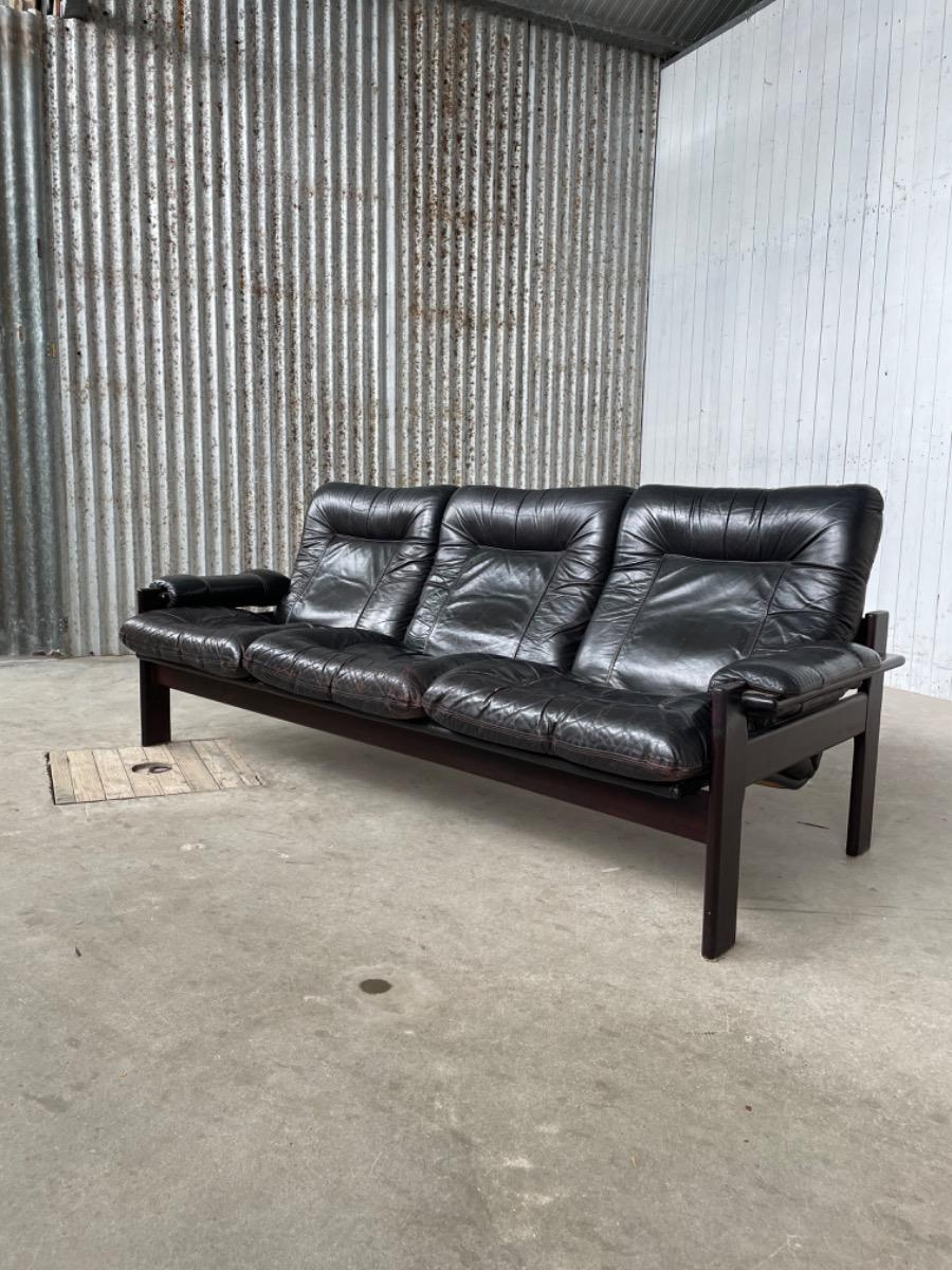 Vintage sofa black thick leather, design 1960s