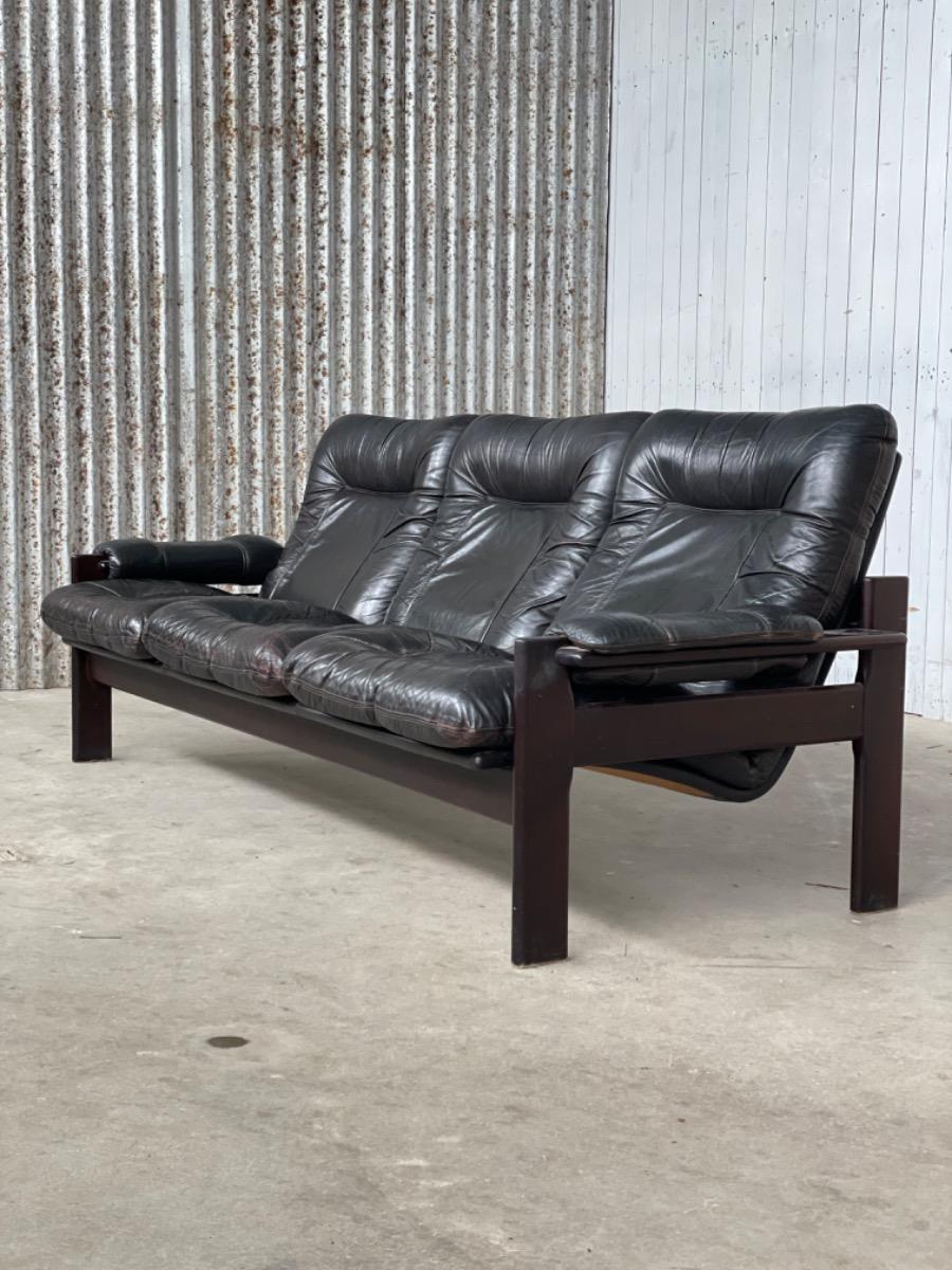 Vintage sofa black thick leather, design 1960s