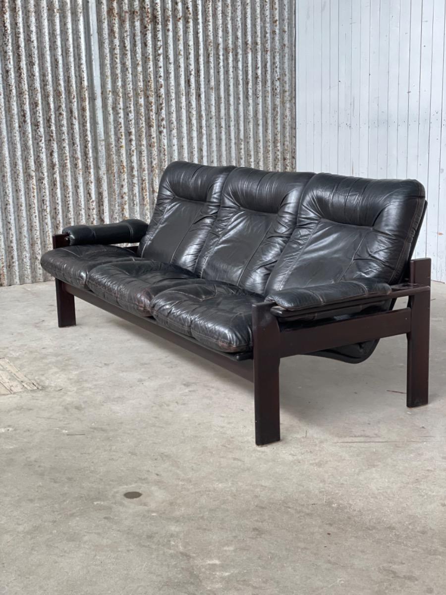 Vintage sofa black thick leather, design 1960s