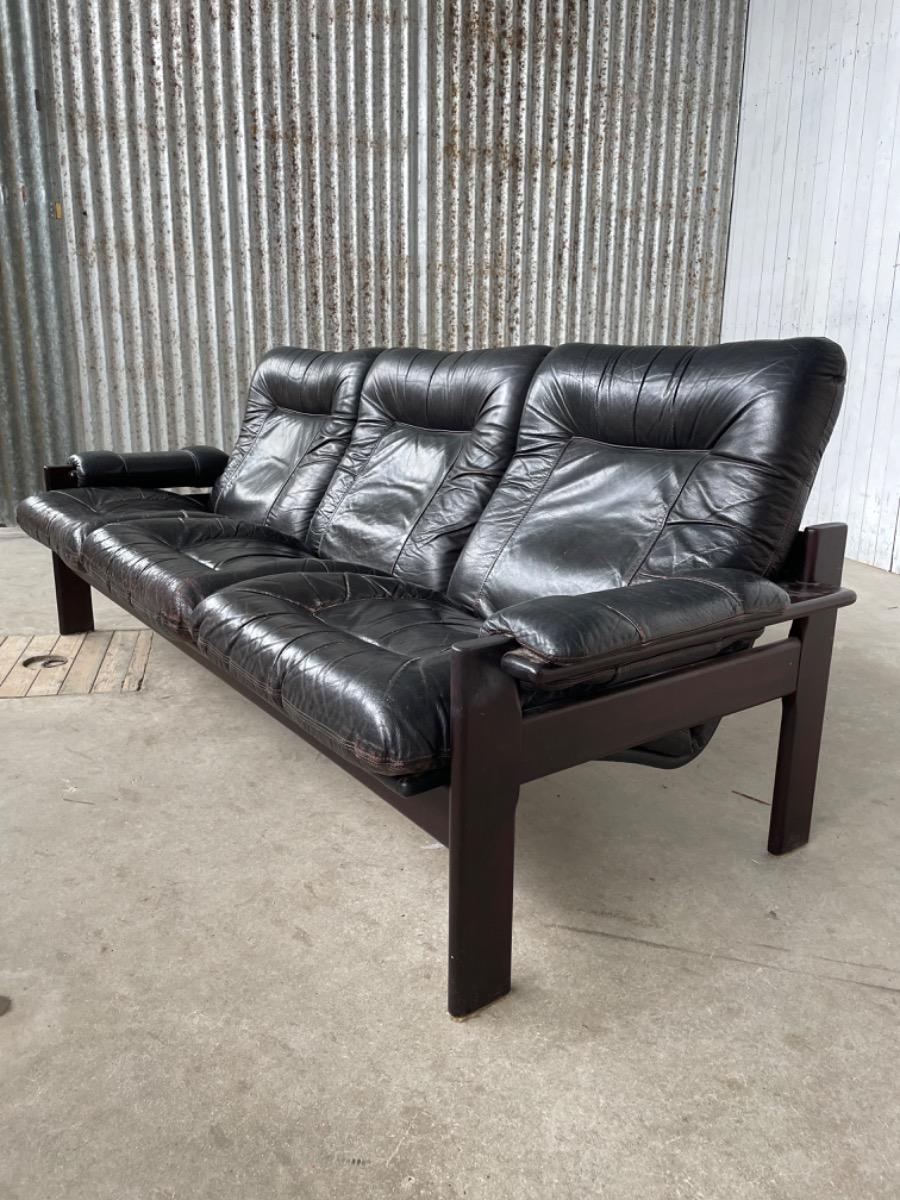 Vintage sofa black thick leather, design 1960s