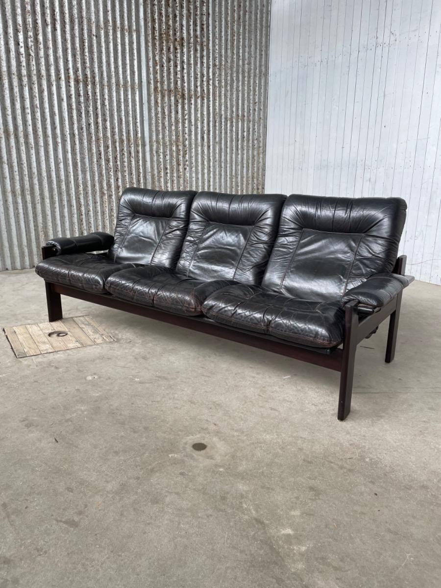 Vintage sofa black thick leather, design 1960s