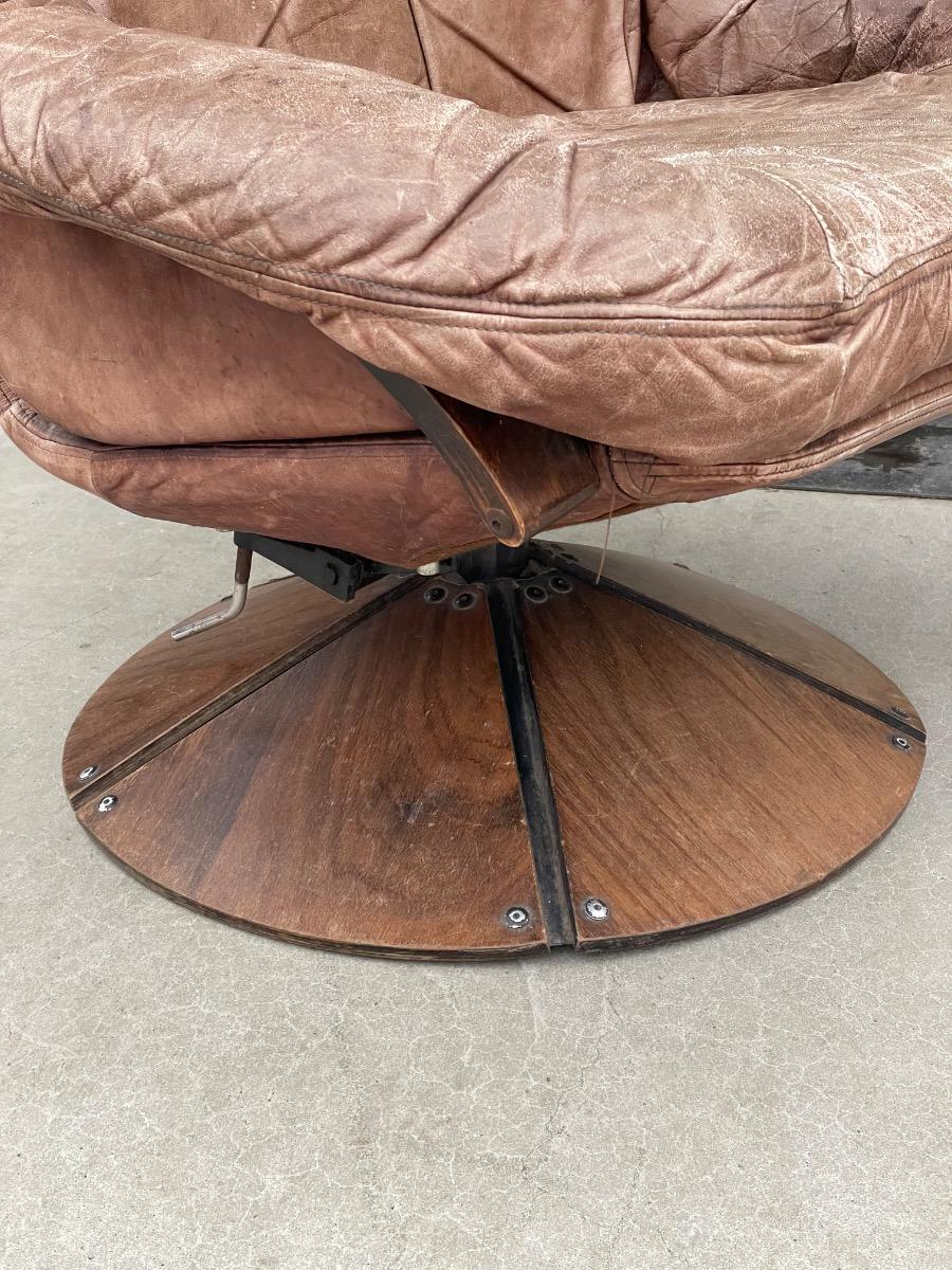 Vintage swivel armchair in brown leather on wooden base 1960s